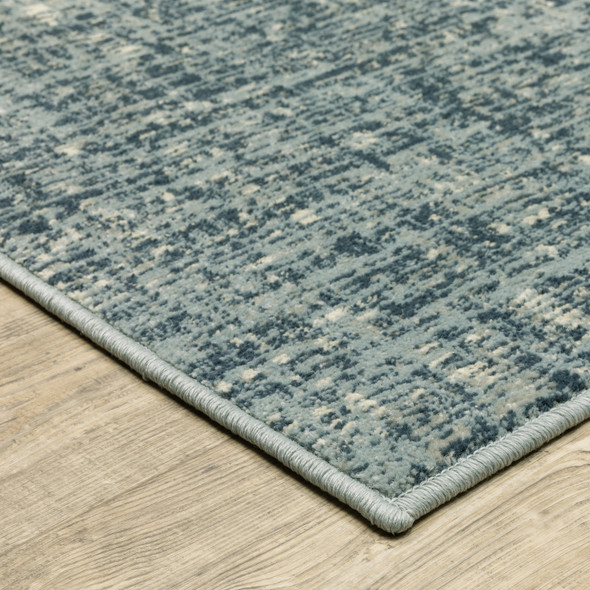 5' X 7' Dark Blue Light Blue Grey Ivory And Beige Abstract Power Loom Stain Resistant Area Rug