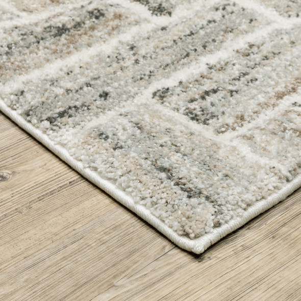 8' X 11' Ivory Beige Grey Brown Pale Blue And Charcoal Geometric Power Loom Stain Resistant Area Rug