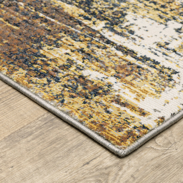 6' X 9' Gold Brown Rust Grey Blue And Beige Abstract Power Loom Stain Resistant Area Rug