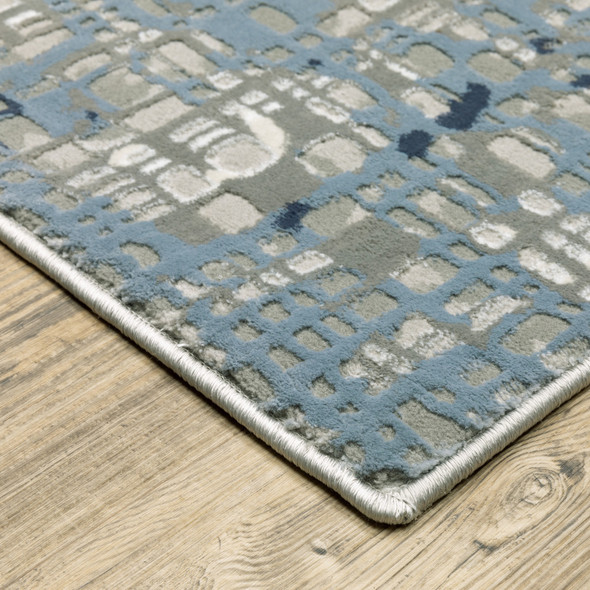 5' X 8' Blue Ivory Grey Brown Beige And Light Blue Abstract Power Loom Stain Resistant Area Rug