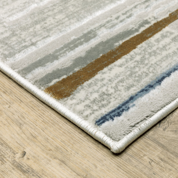 3' X 5' Grey Blue Ivory Brown Beige And Navy Abstract Power Loom Stain Resistant Area Rug