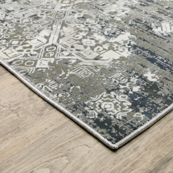 4' X 6' Ivory Grey Blue And Taupe Abstract Power Loom Stain Resistant Area Rug