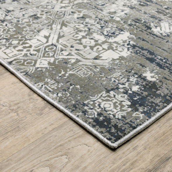 8' X 11' Ivory Grey Blue And Taupe Abstract Power Loom Stain Resistant Area Rug