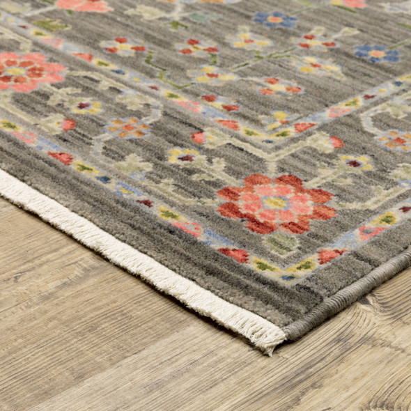 5' X 8' Grey Salmon Pink Gold Blue Rust Deep Blue Ivory And Green Oriental Power Loom Stain Resistant Area Rug With Fringe