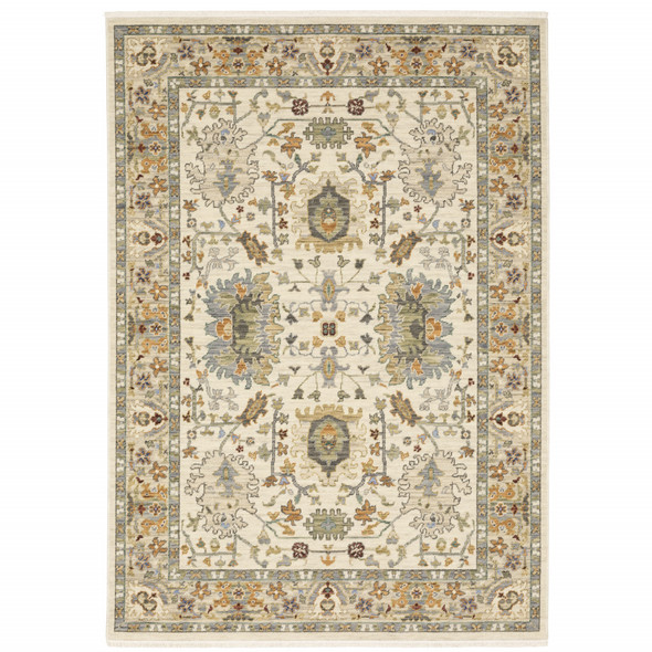 6' X 9' Ivory Grey Orange Green Blue And Red Oriental Power Loom Stain Resistant Area Rug With Fringe