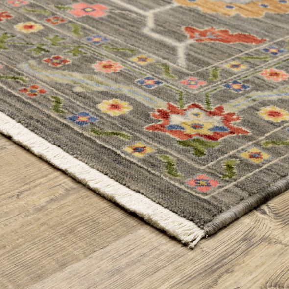 8' X 11' Grey Blue Pink Orange Rust Red Green And Ivory Oriental Power Loom Stain Resistant Area Rug With Fringe