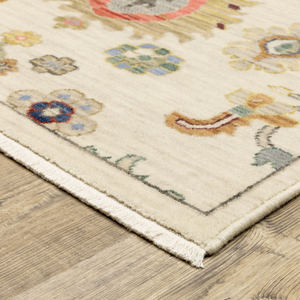 5' X 8' Ivory Beige Gold Grey Blue Pink Red Rust And Green Oriental Power Loom Stain Resistant Area Rug With Fringe