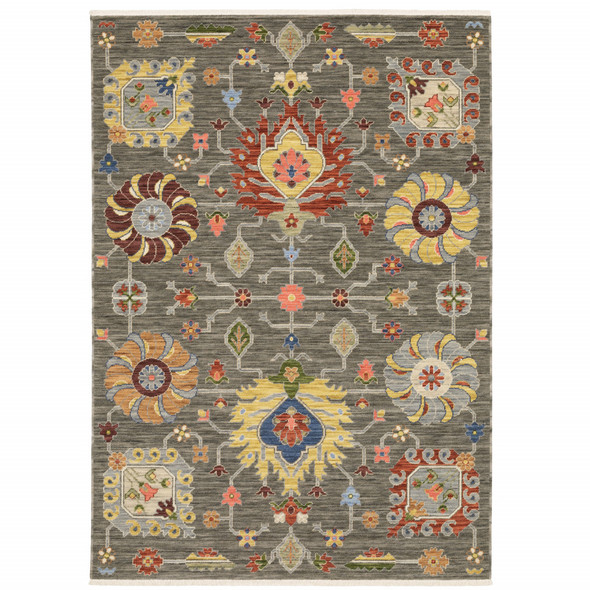 6' X 9' Grey Charcoal Yellow Blue Rust Red Pink Green And Ivory Oriental Power Loom Stain Resistant Area Rug With Fringe