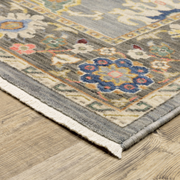 6' X 9' Blue Grey Gold Green Pink Orange Ivory And Red Oriental Power Loom Stain Resistant Area Rug With Fringe