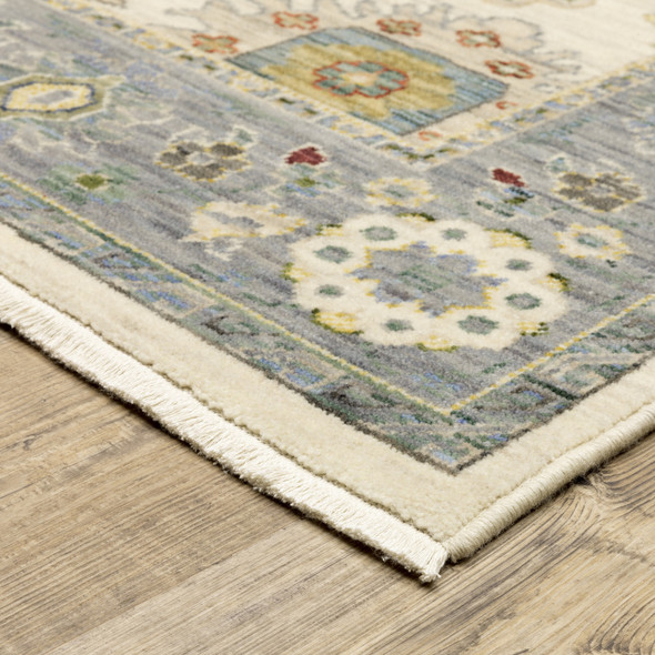 2' X 3' Ivory Blue Grey Teal Gold Green And Rust Oriental Power Loom Stain Resistant Area Rug With Fringe