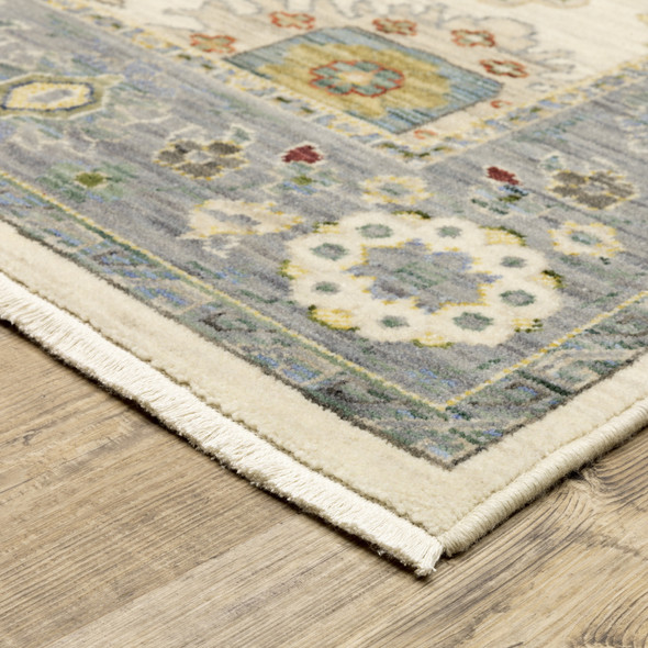 10' X 13' Ivory Blue Grey Teal Gold Green And Rust Oriental Power Loom Stain Resistant Area Rug With Fringe