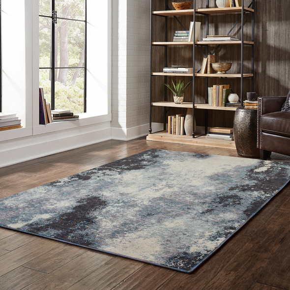 5' X 7' Navy And Ivory Abstract Power Loom Stain Resistant Area Rug