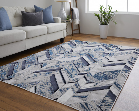 10' X 13' Ivory Blue And Gray Chevron Power Loom Distressed Area Rug
