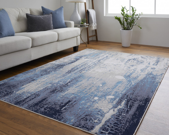 7' X 10' Ivory Blue And Black Abstract Power Loom Distressed Area Rug