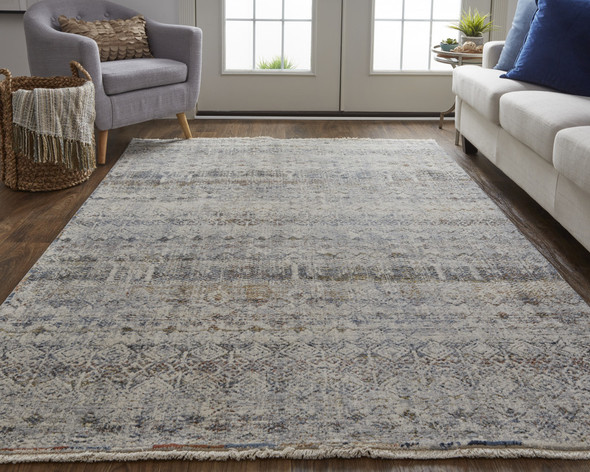 2' X 3' Tan Ivory And Blue Geometric Power Loom Distressed Area Rug With Fringe