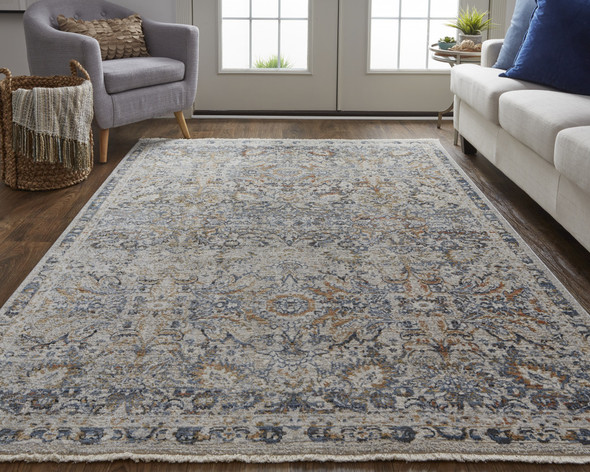 5' X 8' Tan Blue And Orange Floral Power Loom Distressed Area Rug With Fringe