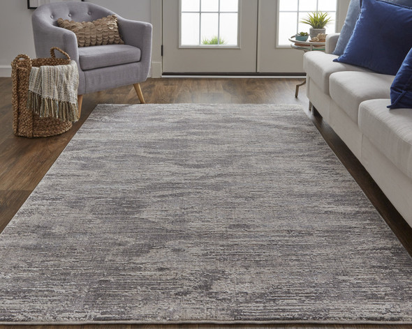 7' X 9' Tan Taupe And Gray Abstract Power Loom Distressed Stain Resistant Area Rug