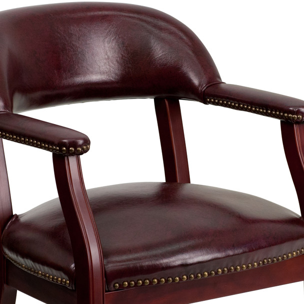 Sarah Oxblood Vinyl Luxurious Conference Chair with Accent Nail Trim and Casters
