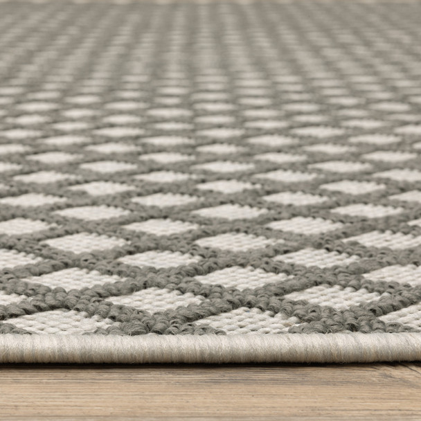 5' X 7' Beige Geometric Stain Resistant Indoor Outdoor Area Rug