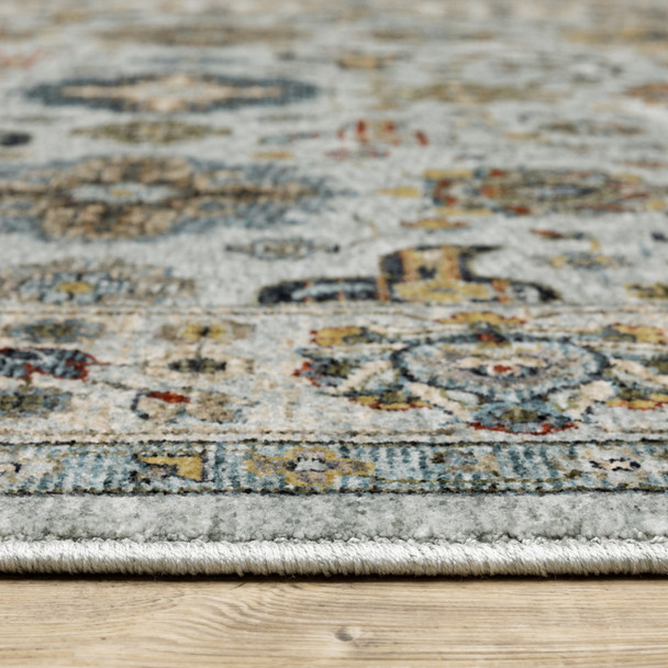 3' X 5' Blue Beige Grey Green Yellow And Rust Oriental Power Loom Stain Resistant Area Rug With Fringe