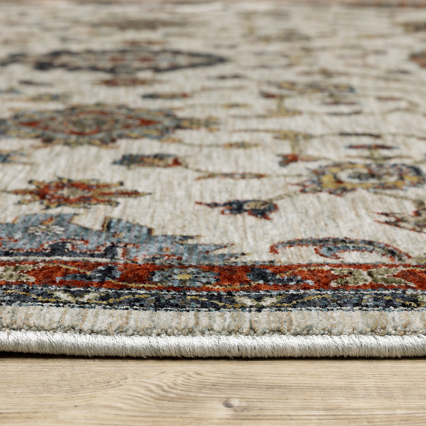 6' X 9' Beige Rust Red Blue Gold And Grey Oriental Power Loom Stain Resistant Area Rug With Fringe