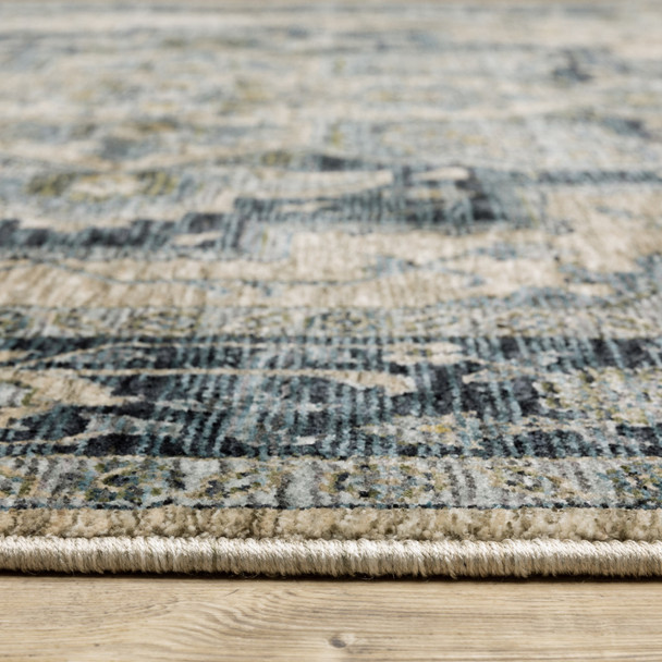 3' X 5' Blue Grey Beige Tan Green And Gold Oriental Power Loom Stain Resistant Area Rug With Fringe