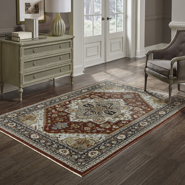 10' X 13' Blue Beige Grey Gold Green And Rust Red Oriental Power Loom Stain Resistant Area Rug With Fringe