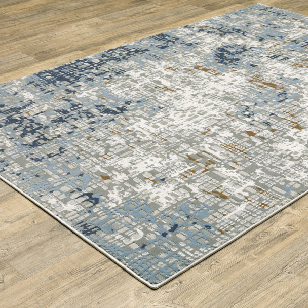 10' X 13' Blue Ivory Grey Brown Beige And Light Blue Abstract Power Loom Stain Resistant Area Rug