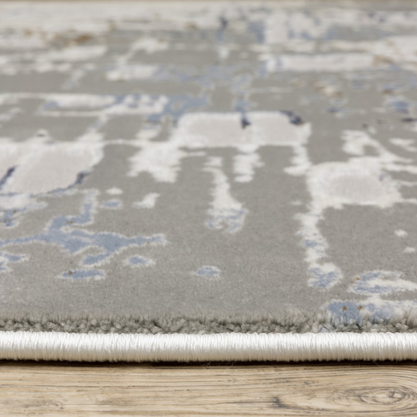6' X 9' Grey Blue Brown Ivory And Deep Blue Abstract Power Loom Stain Resistant Area Rug