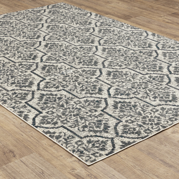 10' X 13' Ivory Blue And Sage Floral Power Loom Stain Resistant Area Rug