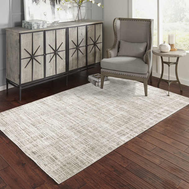 10' X 13' Beige Grey Ivory Tan And Brown Abstract Power Loom Stain Resistant Area Rug