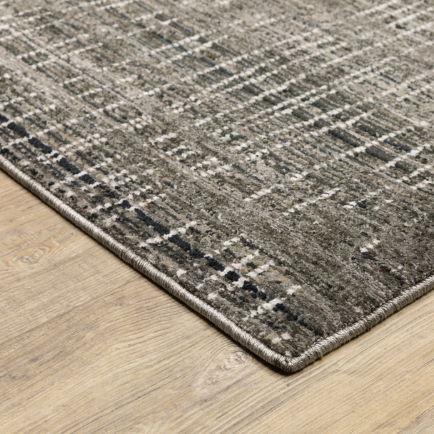 10' X 13' Charcoal Grey Grey Ivory Tan And Brown Abstract Power Loom Stain Resistant Area Rug