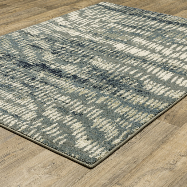 4' X 6' Grey Beige Blue And Light Blue Abstract Power Loom Stain Resistant Area Rug