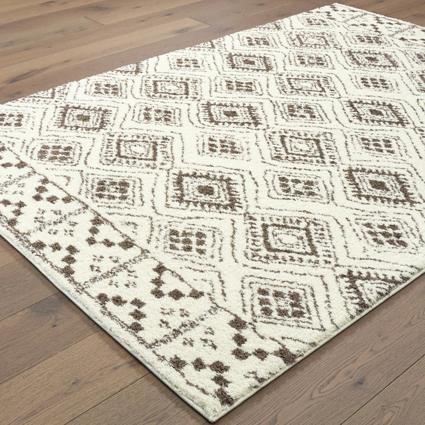 10' X 13' Ivory And Brown Geometric Shag Power Loom Stain Resistant Area Rug
