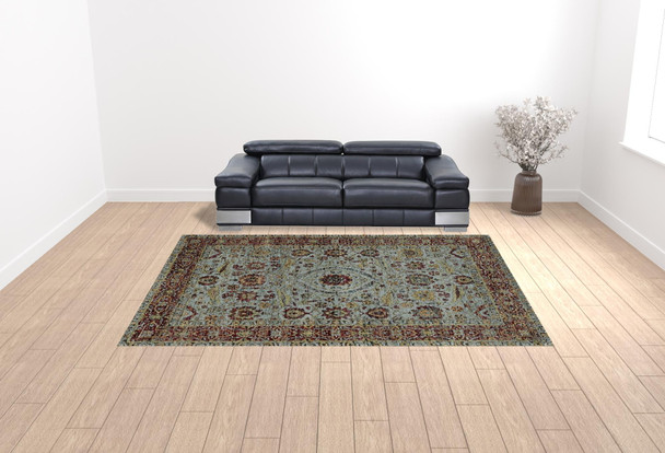 10' X 13' Blue Red Green And Gold Oriental Power Loom Stain Resistant Area Rug