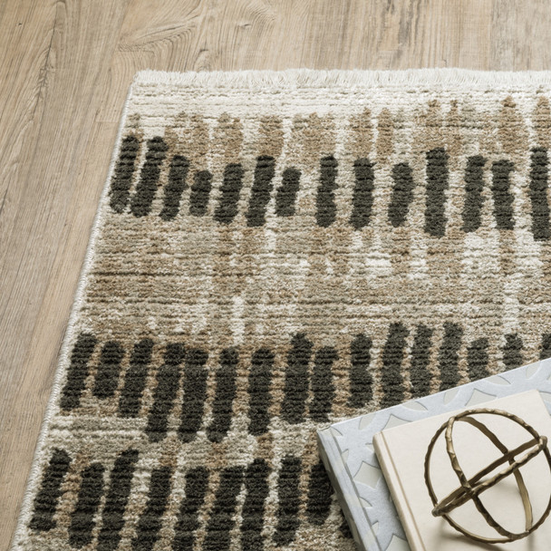 10' X 13' Beige Ivory Charcoal Brown Tan And Grey Abstract Power Loom Stain Resistant Area Rug With Fringe