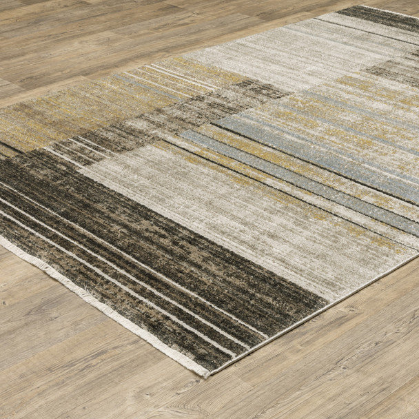 5' X 8' Beige Charcoal Brown Grey Tan Gold And Blue Geometric Power Loom Stain Resistant Area Rug With Fringe