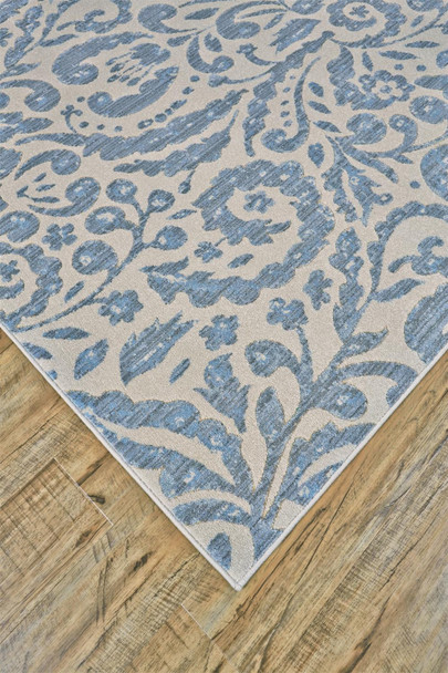 10' X 14' Blue Ivory And Tan Floral Distressed Stain Resistant Area Rug