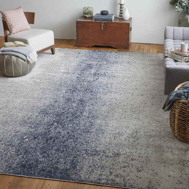 7' X 10' Ivory And Blue Abstract Power Loom Area Rug