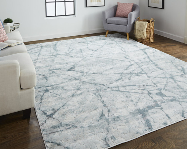 10' X 13' Blue Gray And Ivory Abstract Distressed Stain Resistant Area Rug