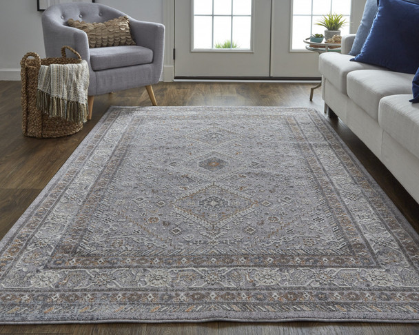 10' X 13' Gray Orange And Ivory Floral Power Loom Stain Resistant Area Rug
