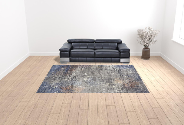 9' X 12' Taupe Blue And Ivory Abstract Power Loom Distressed Stain Resistant Area Rug