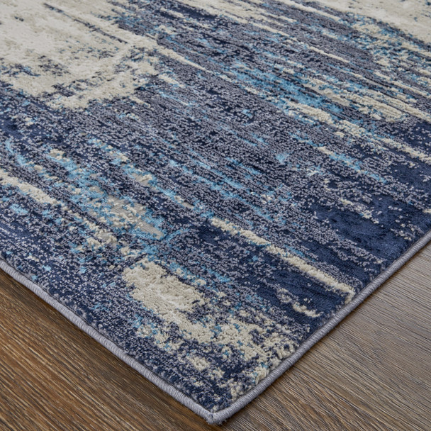 12' X 15' Tan Blue And Ivory Abstract Power Loom Distressed Area Rug