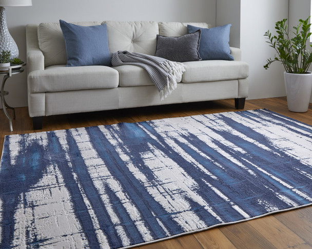 9' X 12' Ivory Blue And Gray Abstract Power Loom Distressed Area Rug