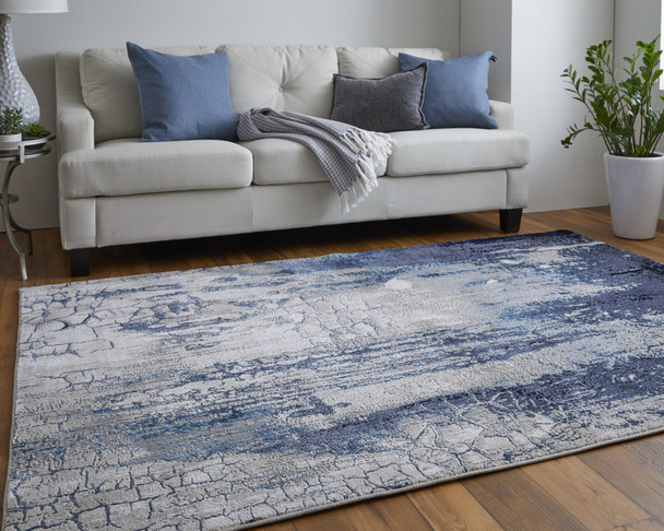 9' X 12' Ivory Blue And Black Abstract Power Loom Distressed Area Rug