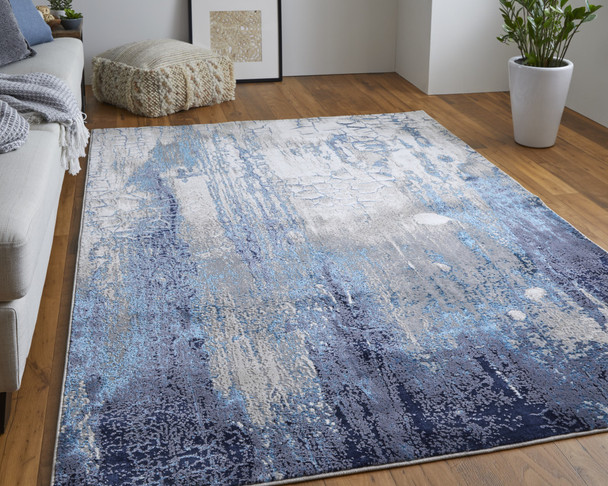 10' X 13' Ivory Blue And Black Abstract Power Loom Distressed Area Rug