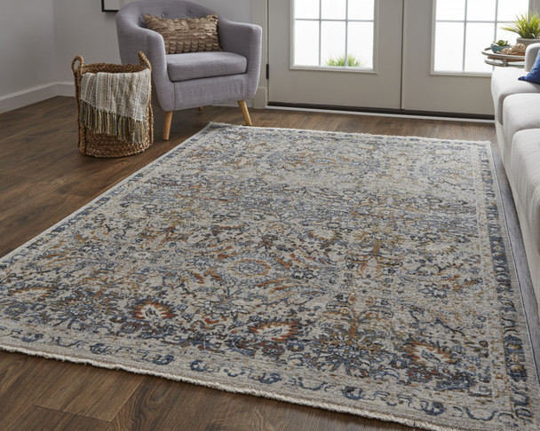 8' X 10' Tan Blue And Orange Floral Power Loom Distressed Area Rug With Fringe