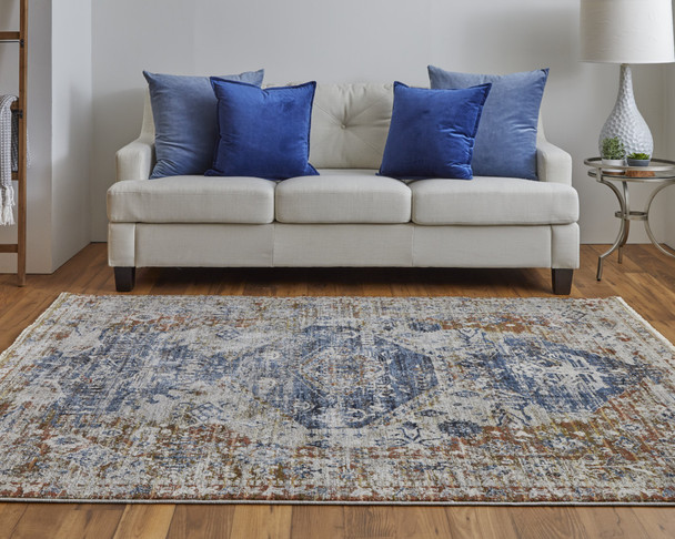 10' X 13' Ivory Orange And Blue Floral Power Loom Distressed Area Rug With Fringe