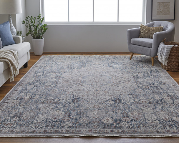 7' X 10' Blue And Ivory Floral Power Loom Stain Resistant Area Rug
