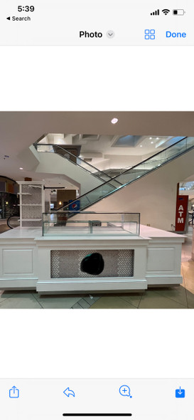 Solid marble kiosk with built-in refrigerator and glass display